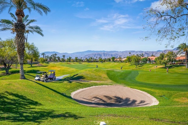 53 Pine Valley Dr, Rancho Mirage, CA 92270 - view of community featuring view of golf course, a mountain view, and a yard
