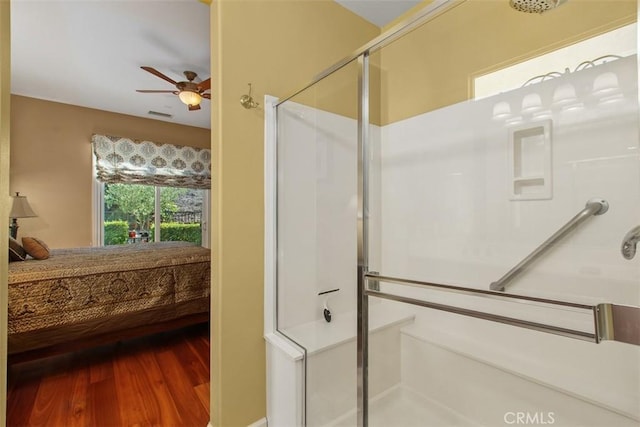 9169 Wooded Hill Dr, Corona, CA 92883 - bathroom with a ceiling fan, visible vents, wood finished floors, and a stall shower