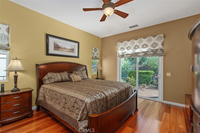 9169 Wooded Hill Dr, Corona, CA 92883 - bedroom featuring visible vents, access to outside, multiple windows, and light wood-type flooring