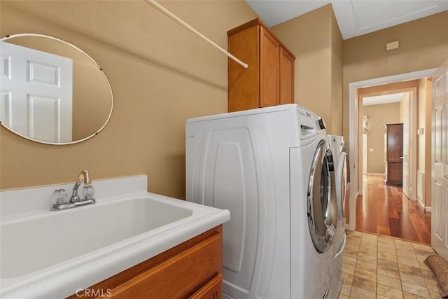 9169 Wooded Hill Dr, Corona, CA 92883 - laundry room featuring a sink, cabinet space, and washer and dryer