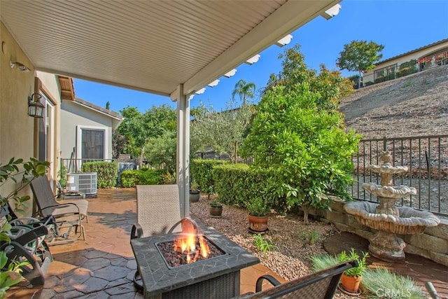 9169 Wooded Hill Dr, Corona, CA 92883 - view of patio with a fire pit and central AC
