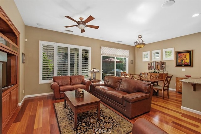 9169 Wooded Hill Dr, Corona, CA 92883 - living room featuring visible vents, baseboards, ceiling fan, recessed lighting, and light wood-style flooring