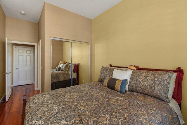 9169 Wooded Hill Dr, Corona, CA 92883 - bedroom featuring baseboards, wood finished floors, and a closet