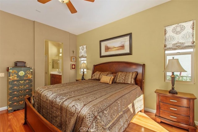 9169 Wooded Hill Dr, Corona, CA 92883 - bedroom with baseboards, a ceiling fan, wood finished floors, and connected bathroom