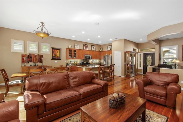 9169 Wooded Hill Dr, Corona, CA 92883 - living room featuring recessed lighting, baseboards, and light wood-type flooring