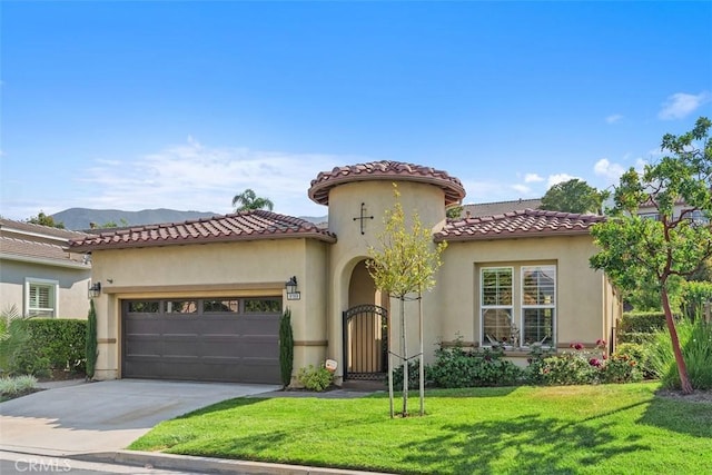 9169 Wooded Hill Dr, Corona, CA 92883 - mediterranean / spanish-style house featuring an attached garage, a front lawn, stucco siding, and concrete driveway