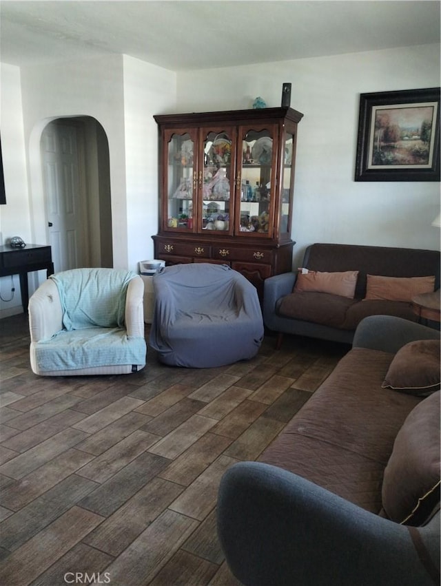 3620 Hoover St, Riverside, CA 92504 - living area featuring arched walkways and dark wood finished floors