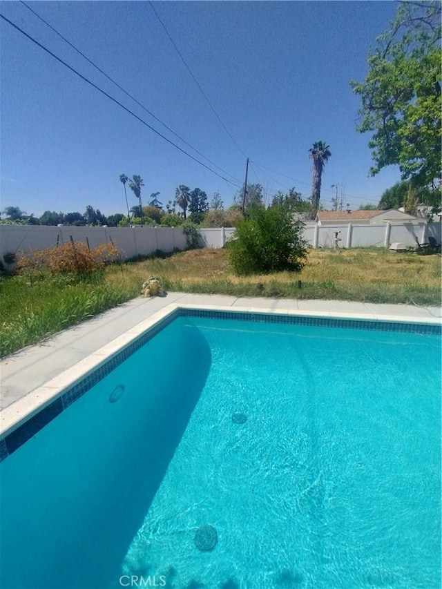 view of swimming pool with a fenced backyard and a fenced in pool