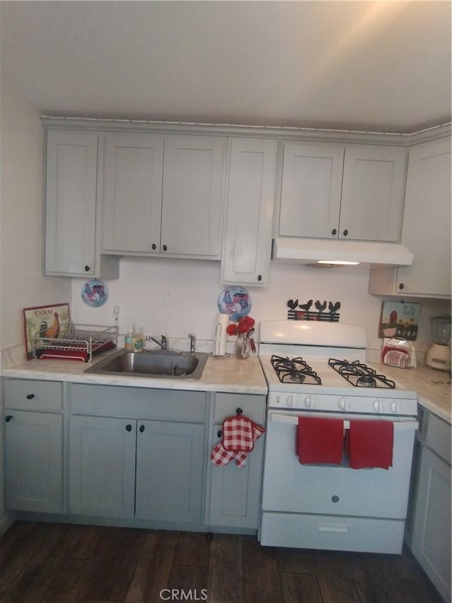 3620 Hoover St, Riverside, CA 92504 - kitchen with white range with gas cooktop, a sink, under cabinet range hood, gray cabinetry, and light countertops