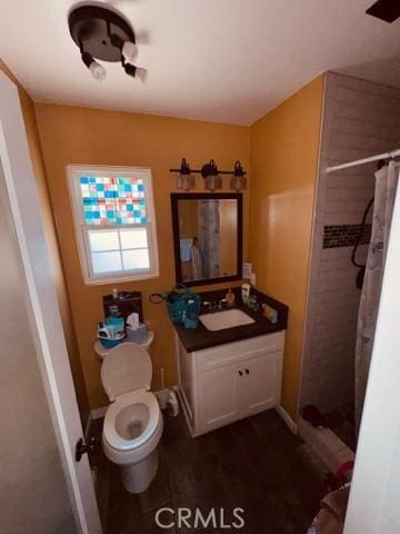 3620 Hoover St, Riverside, CA 92504 - bathroom featuring vanity, toilet, and a shower stall
