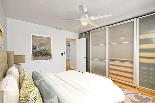 4549 Quailridge Dr, Oceanside, CA 92056 - bedroom with wood finished floors and a ceiling fan