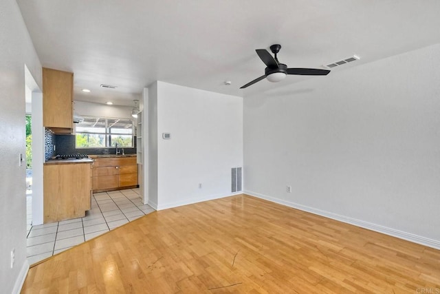 4549 Quailridge Dr, Oceanside, CA 92056 - unfurnished living room featuring light wood finished floors and ceiling fan