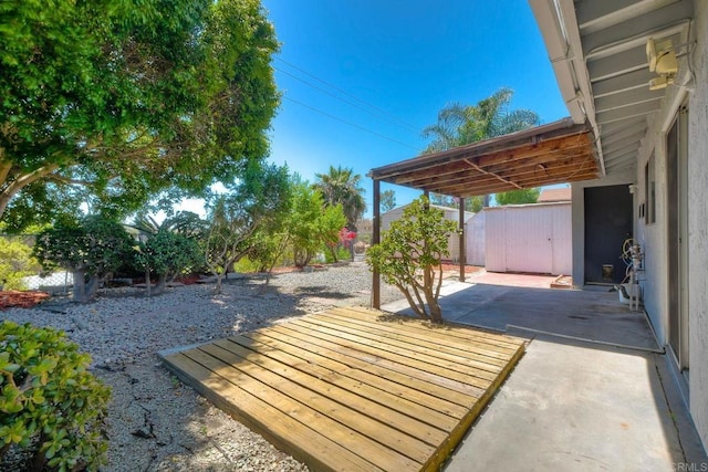 4549 Quailridge Dr, Oceanside, CA 92056 - fenced backyard featuring a patio and a storage unit