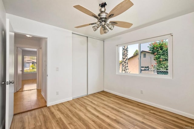 4549 Quailridge Dr, Oceanside, CA 92056 - unfurnished bedroom featuring light wood finished floors, a closet, and ceiling fan