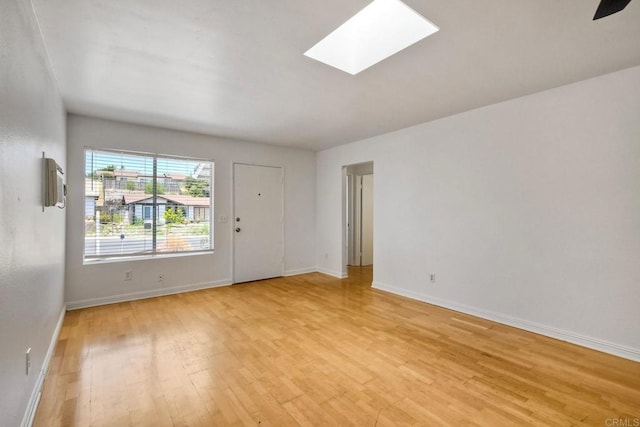 4549 Quailridge Dr, Oceanside, CA 92056 - unfurnished room with light wood finished floors and a skylight