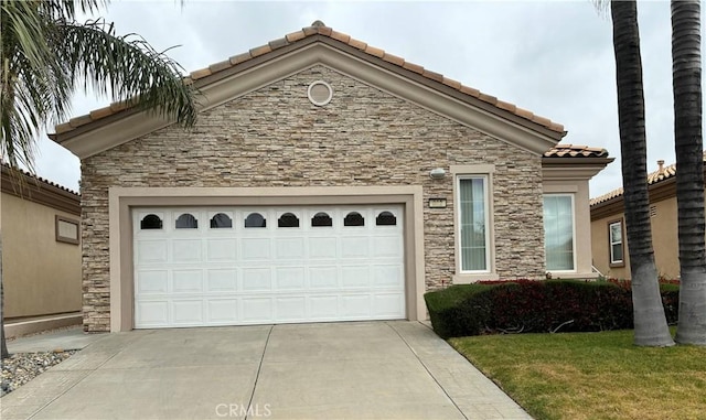 322 Brooklawn Dr, Banning, CA 92220 - ranch-style home with an attached garage, a front lawn, stone siding, a tiled roof, and driveway