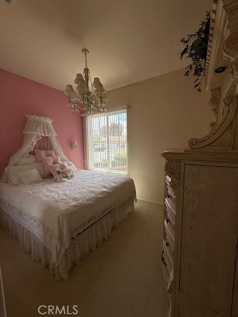 322 Brooklawn Dr, Banning, CA 92220 - bedroom with a chandelier and light carpet