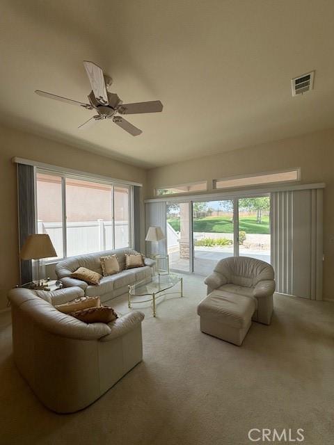 322 Brooklawn Dr, Banning, CA 92220 - carpeted living area featuring a ceiling fan and visible vents