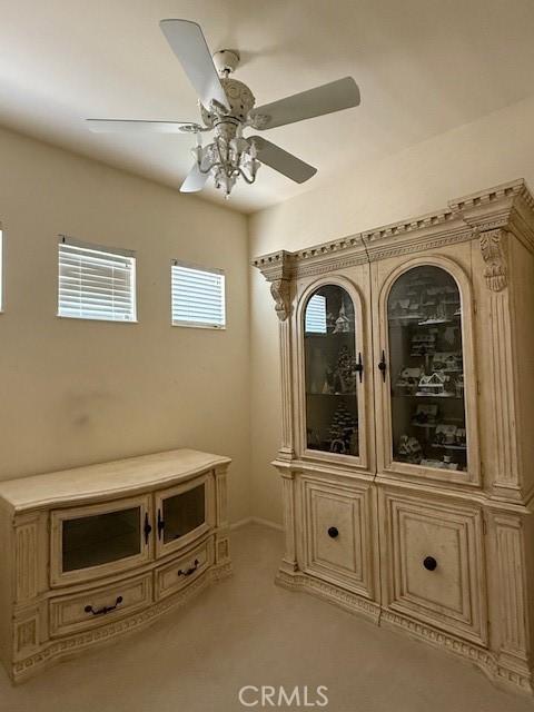 322 Brooklawn Dr, Banning, CA 92220 - doorway with ceiling fan and light carpet