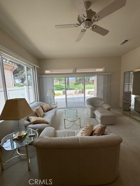 322 Brooklawn Dr, Banning, CA 92220 - carpeted living room featuring ceiling fan and visible vents