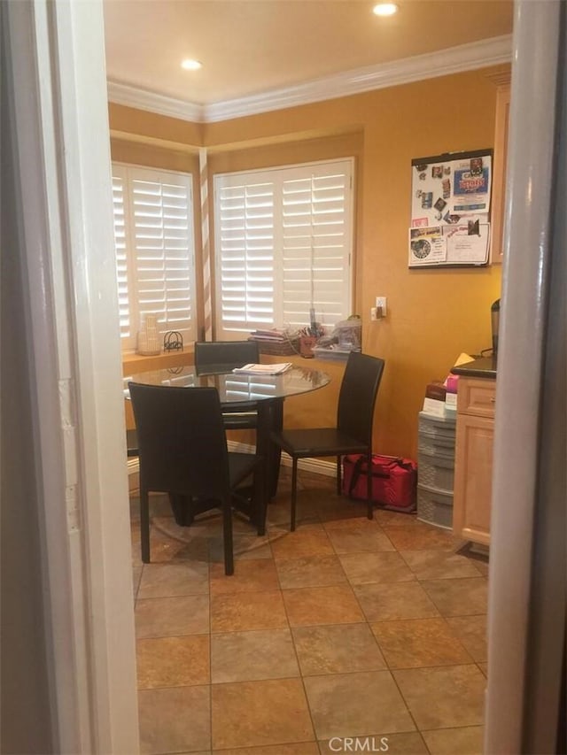 dining area featuring crown molding and recessed lighting