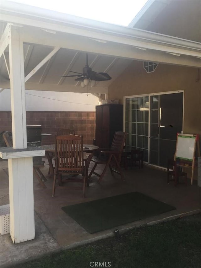 view of patio / terrace with ceiling fan and outdoor dining space
