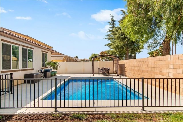 view of swimming pool featuring a fenced backyard, a fenced in pool, and a patio area