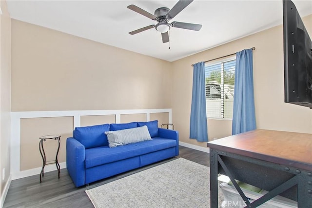 office area featuring baseboards, a ceiling fan, and wood finished floors