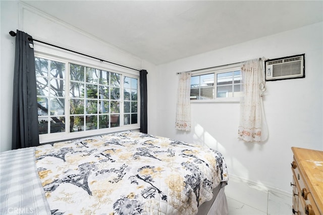 bedroom featuring baseboards, a wall mounted air conditioner, and marble finish floor