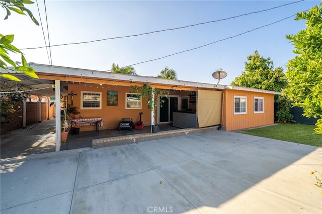 back of house featuring fence and a patio area