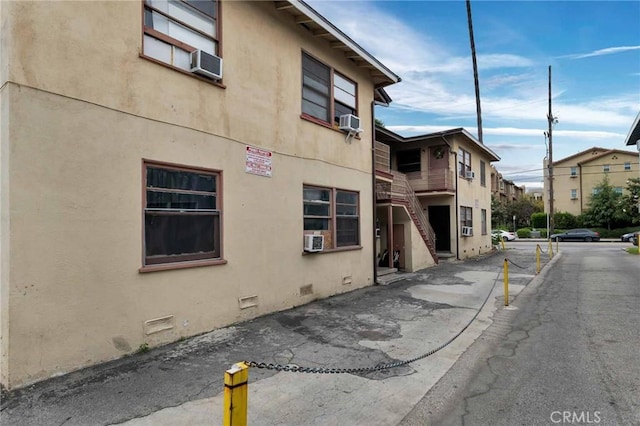 view of building exterior with cooling unit