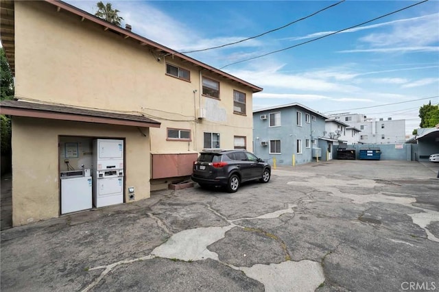view of parking / parking lot with separate washer and dryer