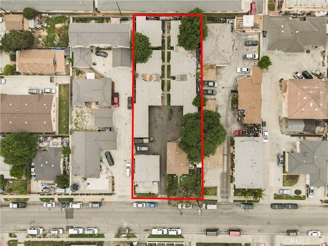 birds eye view of property with a residential view