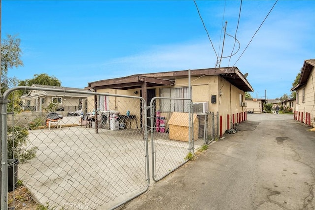 view of outdoor structure with fence and a gate