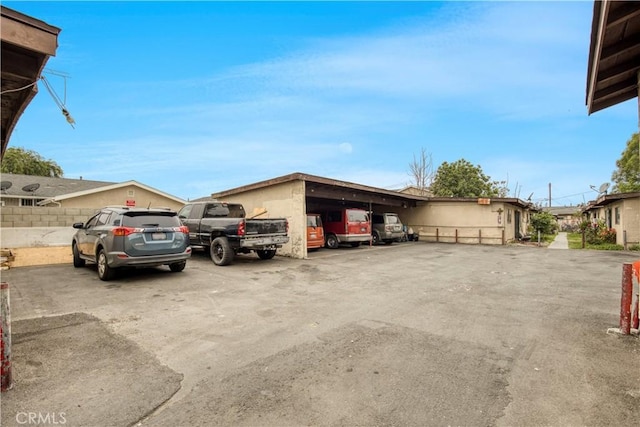 view of partially covered parking lot