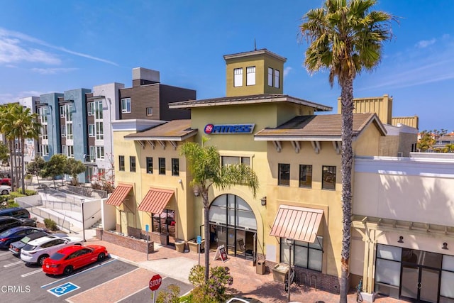 view of property with uncovered parking