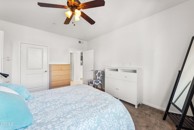 bedroom featuring baseboards, ceiling fan, carpet, and visible vents