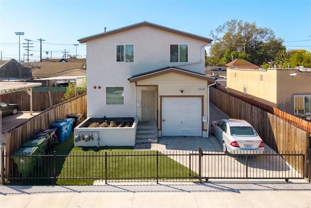 1566 E 106th St, Los Angeles, CA 90002 - view of front facade featuring a garage, stucco siding, concrete driveway, and fence private yard