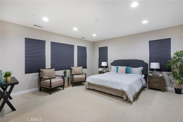 carpeted bedroom featuring recessed lighting, baseboards, and visible vents