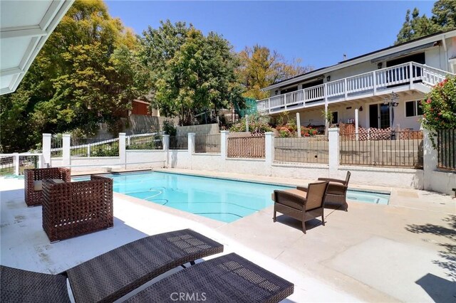 view of pool featuring a fenced in pool, a patio area, and fence