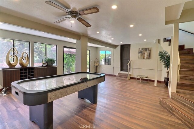 recreation room with baseboards, recessed lighting, ceiling fan, and wood finished floors
