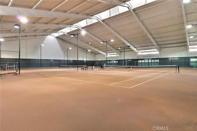 view of sport court featuring fence