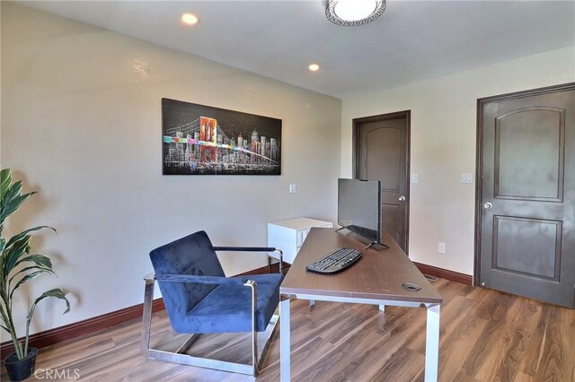home office featuring baseboards, recessed lighting, and wood finished floors