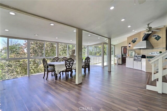 dining room featuring dark wood-style flooring, ceiling fan, recessed lighting, and floor to ceiling windows