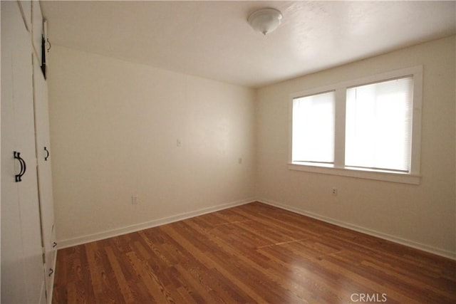 200 E St, Taft, CA 93268 - unfurnished room featuring baseboards and wood finished floors