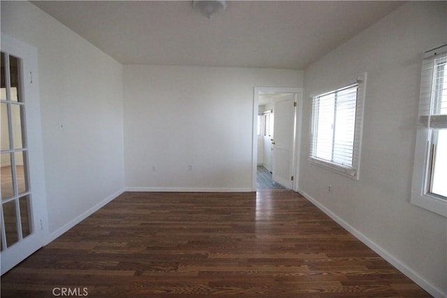 200 E St, Taft, CA 93268 - spare room featuring baseboards and wood finished floors
