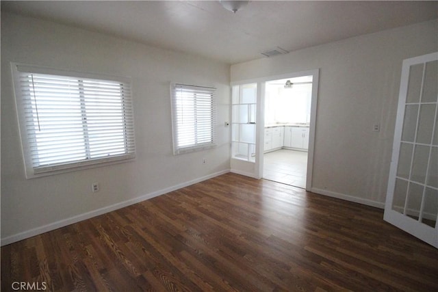 200 E St, Taft, CA 93268 - empty room with visible vents, baseboards, and wood finished floors