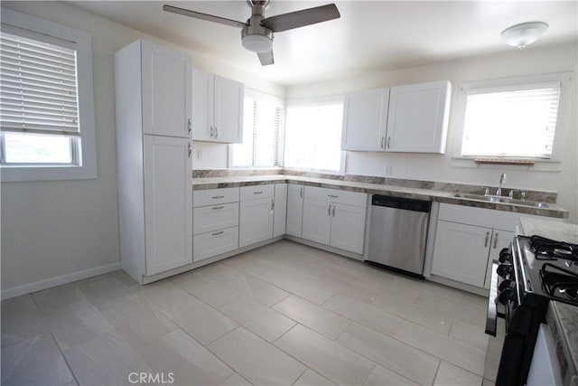 200 E St, Taft, CA 93268 - kitchen featuring plenty of natural light, a ceiling fan, dishwasher, a sink, and gas stove