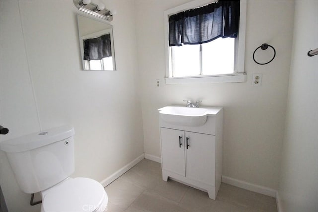 200 E St, Taft, CA 93268 - half bath with vanity, baseboards, and toilet