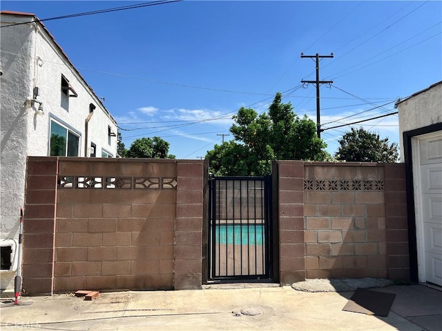 view of gate featuring fence